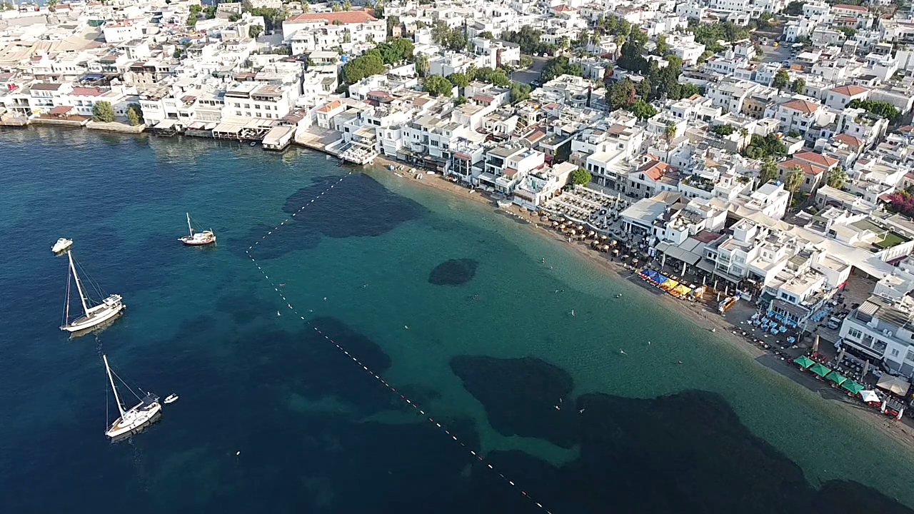 Aerial view of Bodrum's coastline, white houses and the bay