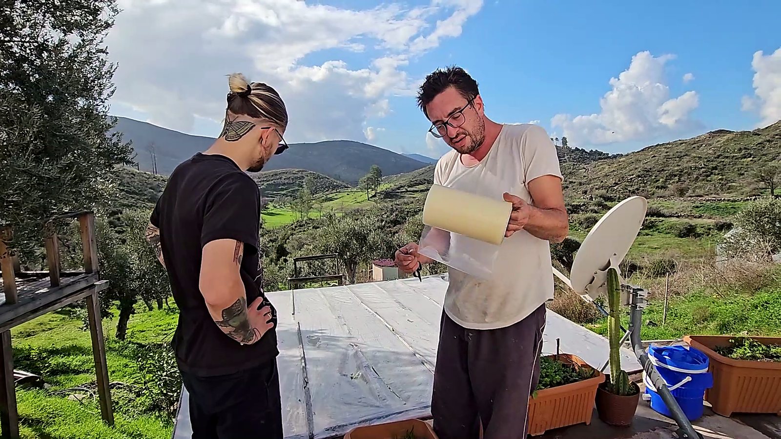 Guests working together on the rooftop terrace overlooking the valley