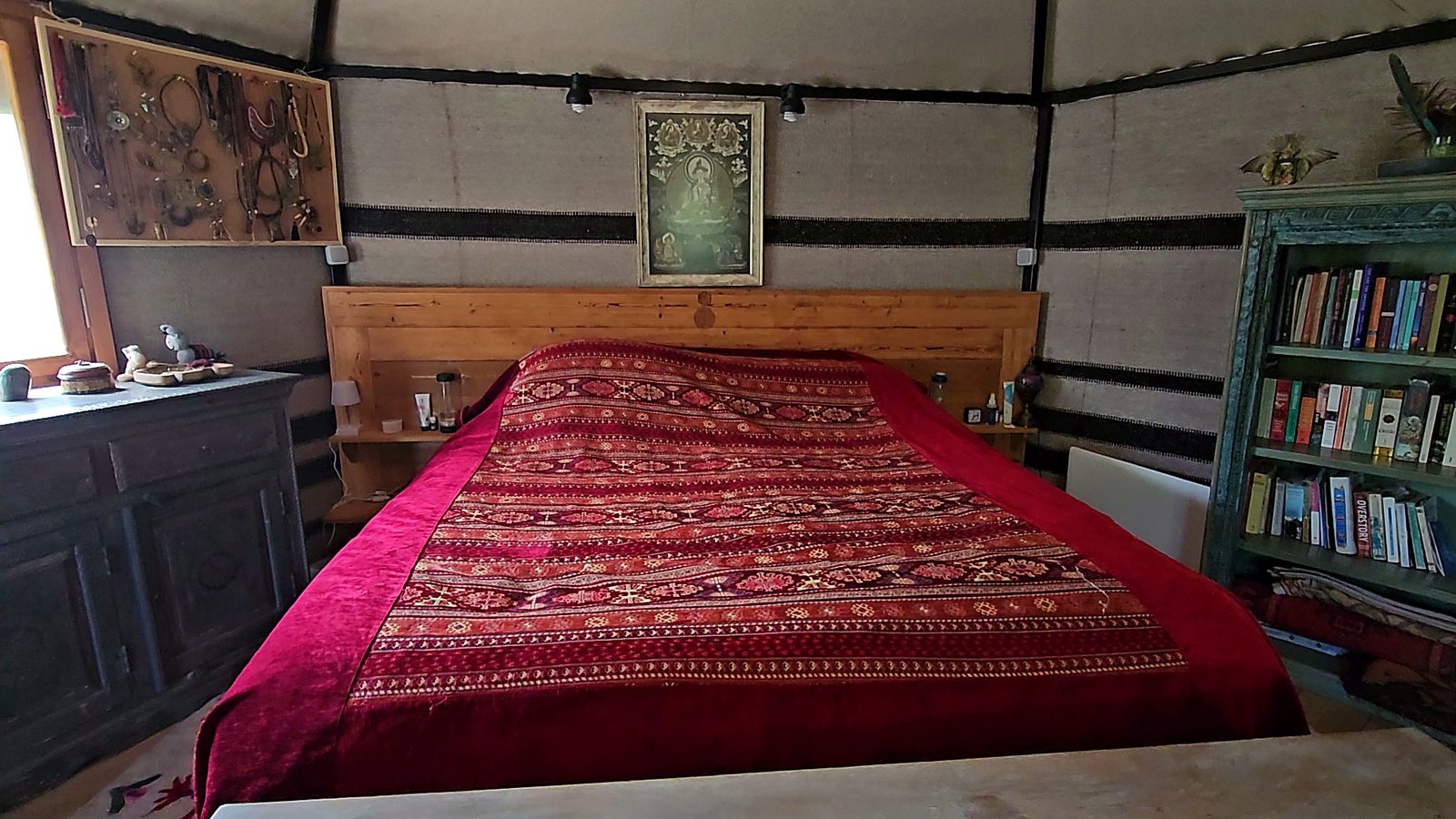 Cozy bedroom interior with a kilim bedspread and reading nook